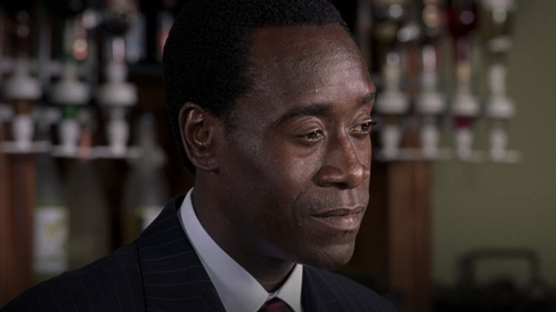Paul Rusesabagina tending bar