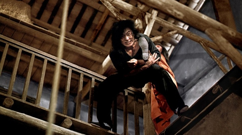 Dragon fighting someone in the rafters in Dragon Lord (1982)