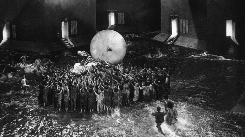 Citizens gathered around a huge object in Metropolis