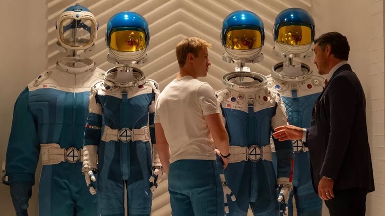 Johnny and Reed inspect the new spacesuits in "The Fantastic Four: First Steps" (2025)