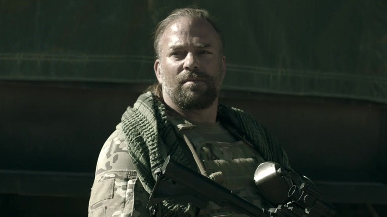 Vasquez in fatigues holding a gun in "Sniper: Special Ops" (2016)