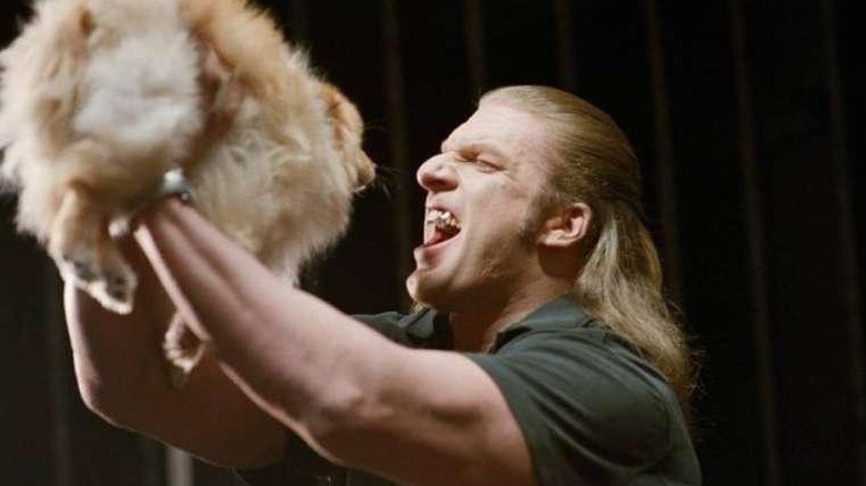 Jarko holds up a dog in "Blade: Trinity" (2004)