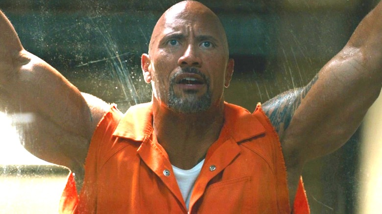 Hobbes flexing his arms in "The Fate of the Furious" (2017)