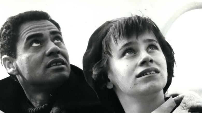 Rita Tushingham and Paul Danquah staring up