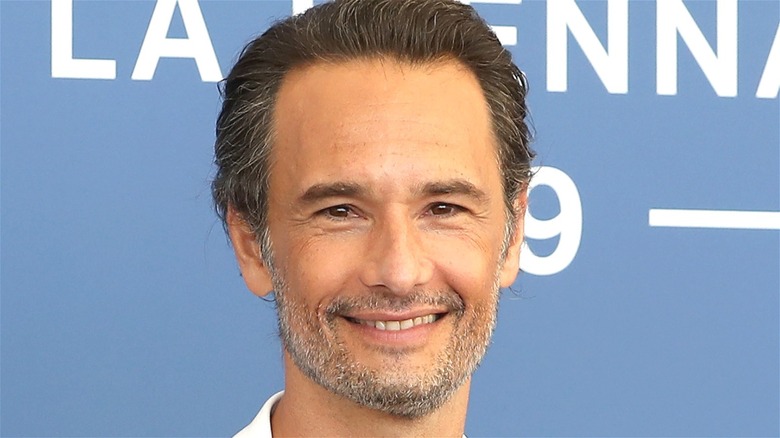 Rodrigo Santoro smiles on red carpet