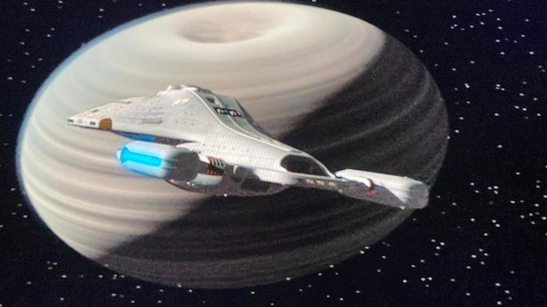 The USS Voyager approaching a strange planet in "Star Trek: Voyager"