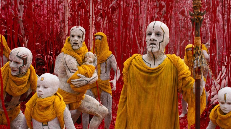 A group of Nibrians looking shocked in a red forest in "Star Trek Into Darkness"