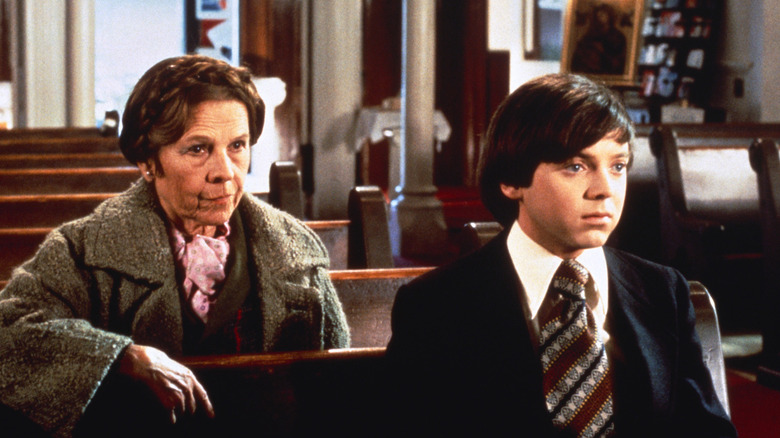 Harold and Maude sit in a church in Harold and Maude (1971)