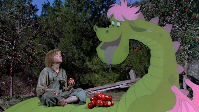 Pete eating apples on Elliott's back in "Pete's Dragon"