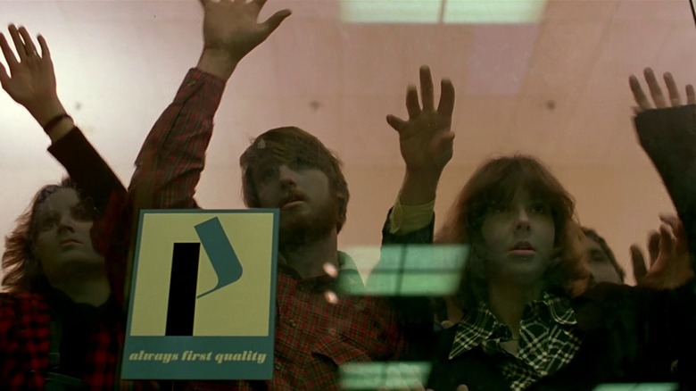 Zombies banging on the glass door to the Monroeville Mall in Dawn of the Dead