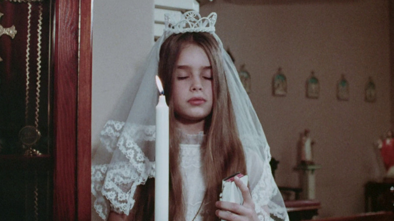 Karen holding a candle in "Alice, Sweet Alice."