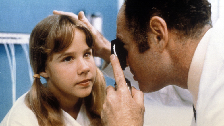 Dr. Klein examining Regan's eye (1971)