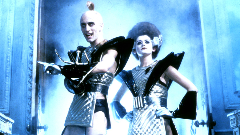 Riff Raff and Magenta in sci-fi outfits in The Rocky Horror Picture Show (1975)