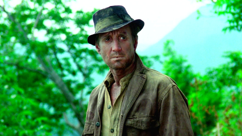 Jackie standing in the woods in Sorcerer (1977)