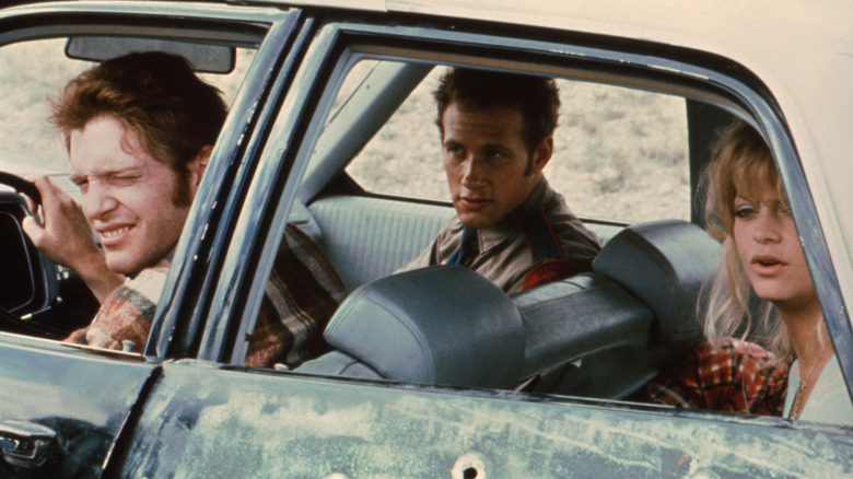 Clovis, Slide, and Lou sitting in a car in The Sugarland Express (1974)