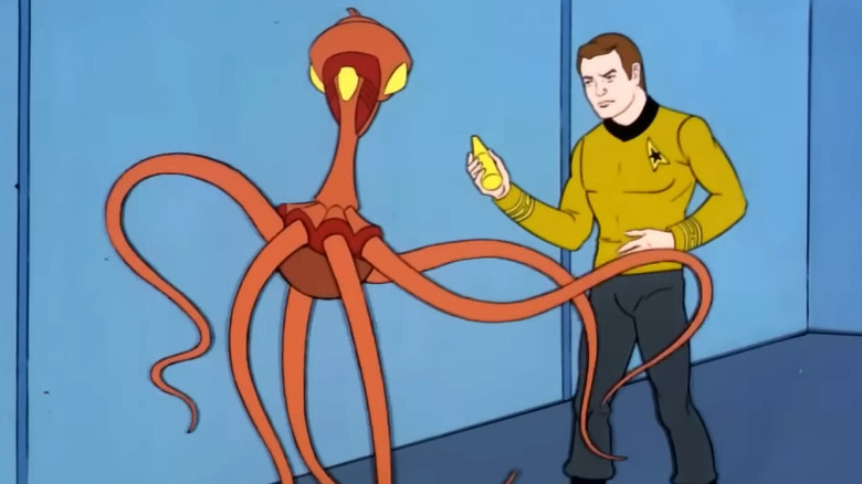 Captain James T. Kirk looking at an alien in "Star Trek: The Animated Series"