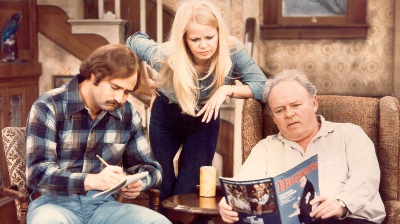 Michael, Gloria, and Archie in living room