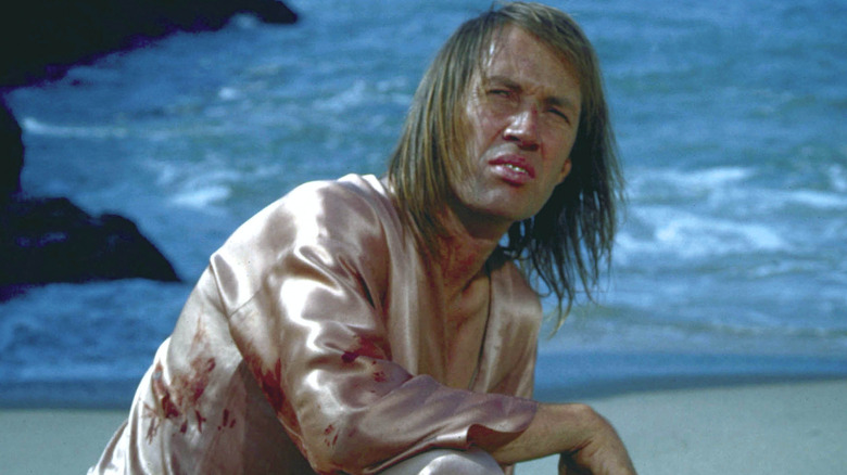 Kwai Chang Caine kneeling on beach