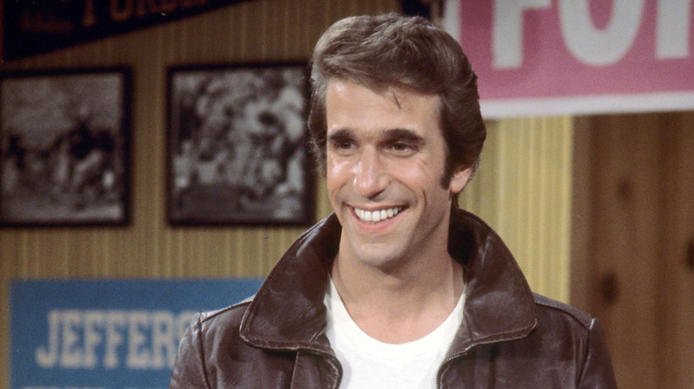 Fonzie in Arnold's diner smiling