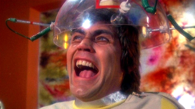 Lew Picard grimaces as a brain device is used on him in Space: 1999 (1975)