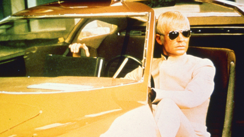Commander Straker sitting in a yellow car in UFO (1970)