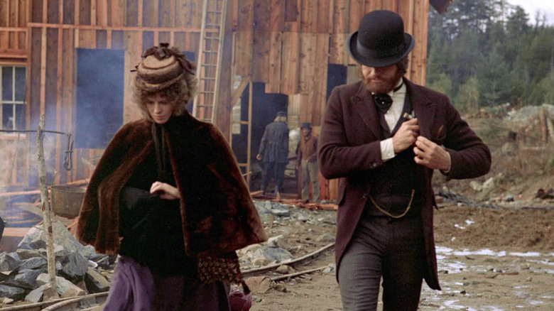 John McCabe & Mrs. Miller walking around a crumbling building in "McCabe & Mrs. Miller" (1971)