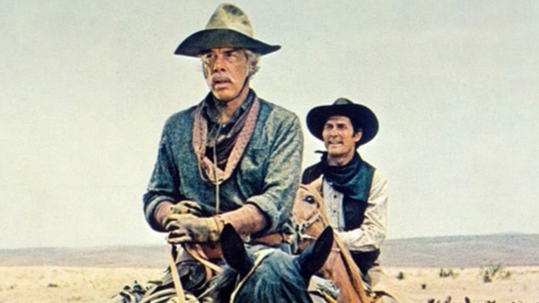 Monte and Chet on horseback heading out for an adventure in "Monte Walsh" (1970)