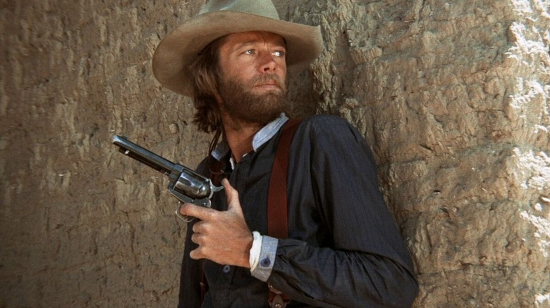 Harry Collings getting his gun ready in "The Hired Hand" (1971)
