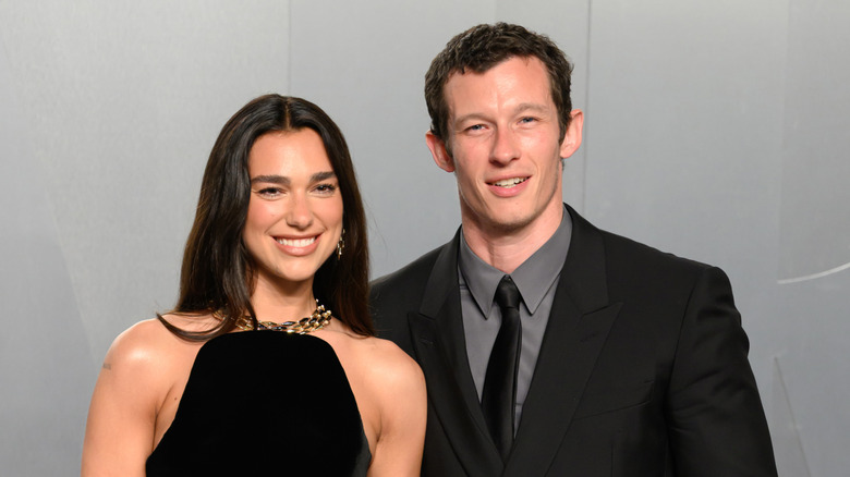 Dua Lipa poses with Callum Turner