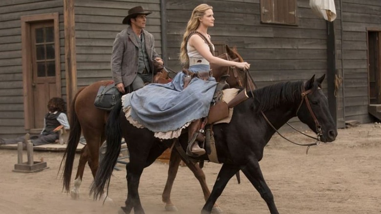 Hosts Teddy (James Marsden) and Dolores (Evan Rachel Wood) riding their horses through Westworld