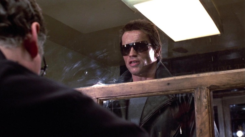 The Terminator standing at the police station in The Terminator (1984)