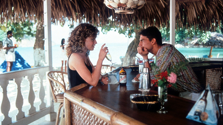 Brian Flanagan behind a bar flirting with Jordan Mooney as she sips champagne