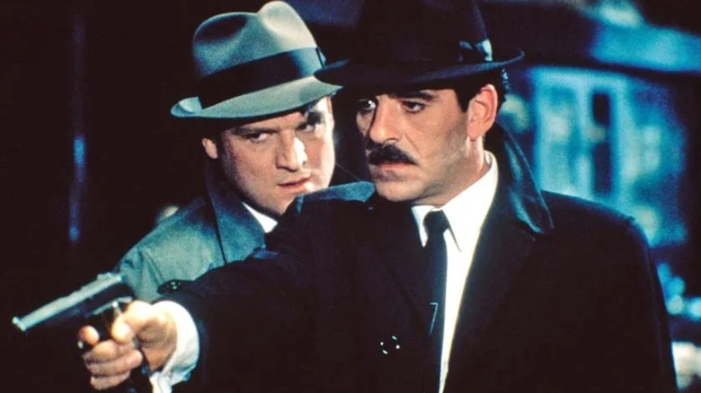 Lt. Mike Torello aiming a gun in "Crime Story"