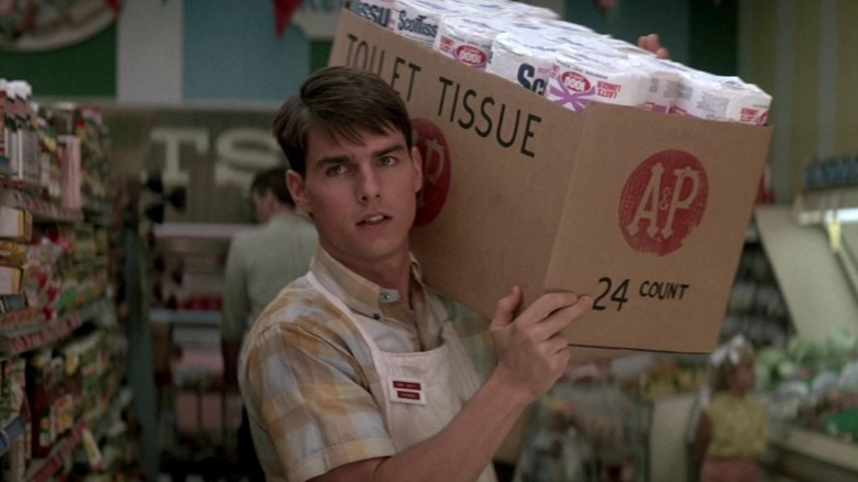 Tom Cruise as Ron in "Born on the Fourth of July" with a box of toilet paper on his shoulder