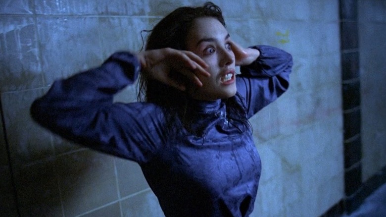 Anna dances in the subway with a wild expression in "Possession" (1981)