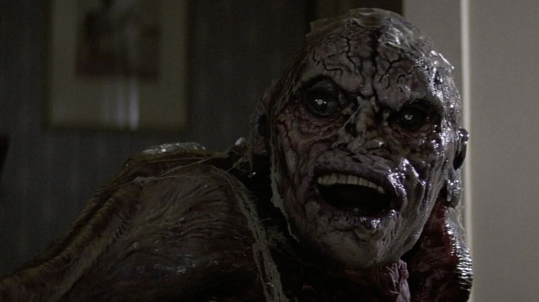 The vomit creature looks over its shoulder in "Poltergeist II: The Other Side" (1986)
