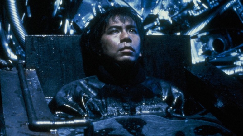 Salaryman half submerged in Tetsuo: The Iron Man (1989)