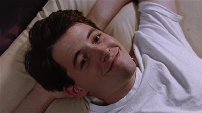 Ferris lying in bed smiling in 