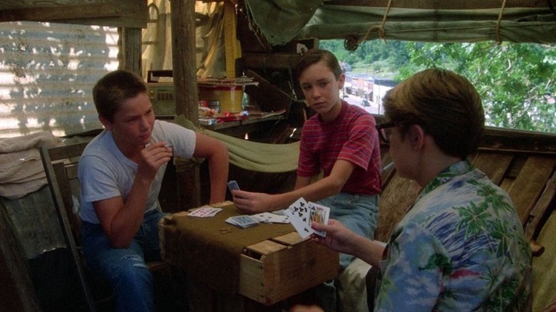 Chris, Gordie, and Teddy playing cards in "Stand by Me" (1986)