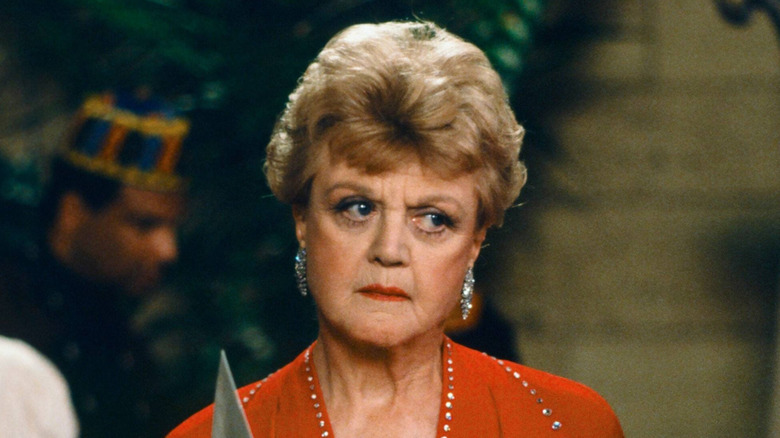 Jessica Fletcher is unsure while holding a menu in "Murder, She Wrote"
