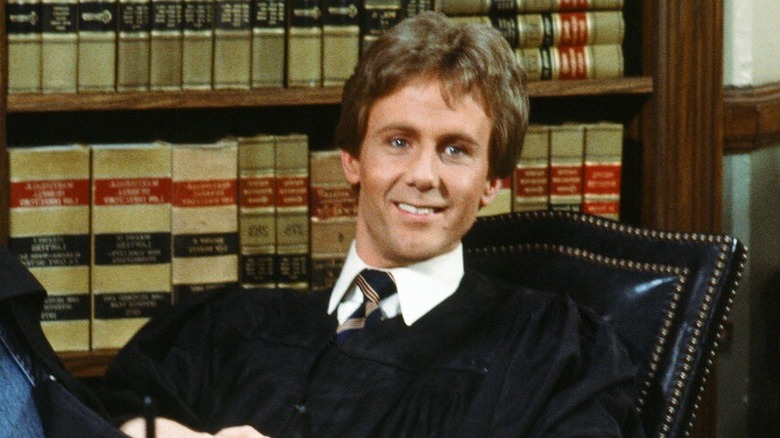 Judge Harold "Harry" T. Stone leaning back in his chair in "Night Court"