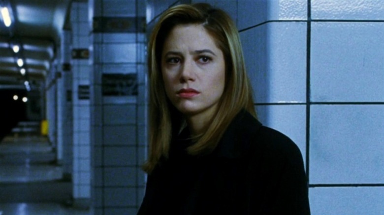 Susan Tyler standing in an empty subway station