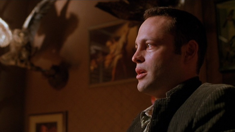 Norman Bates with a bird in the corner of the room in 1998's Psycho
