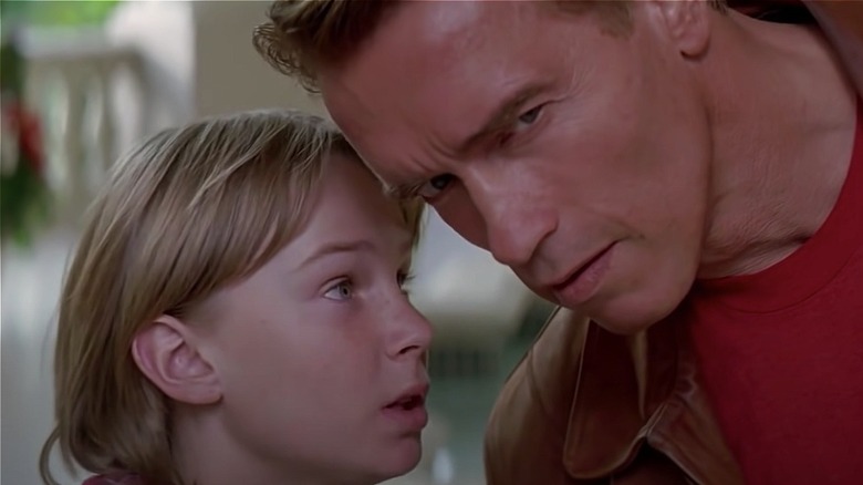 Danny Madigan whispers to Jake Slater in Last Action Hero (1993)