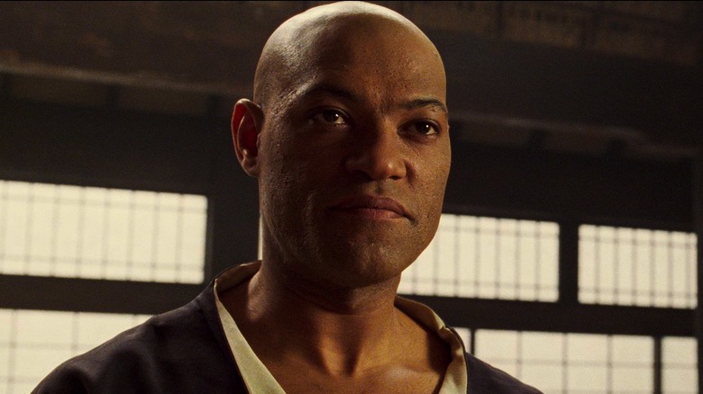 Morpheus standing in dojo in The Matrix (1999)