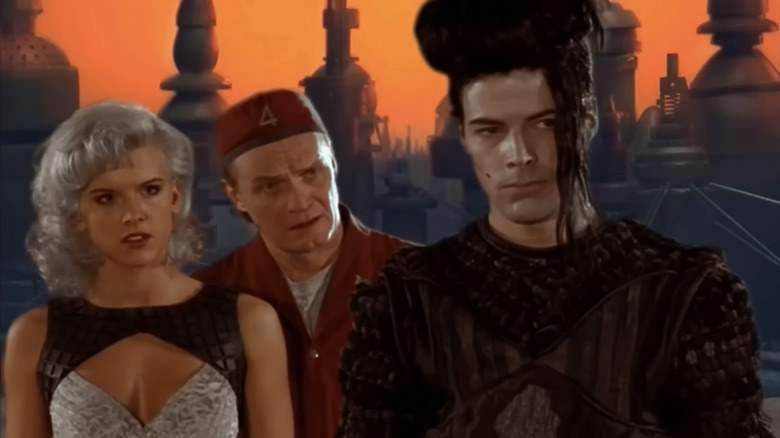 Zev Bellringer, Stanley Tweedle, and Kai standing together in Lexx