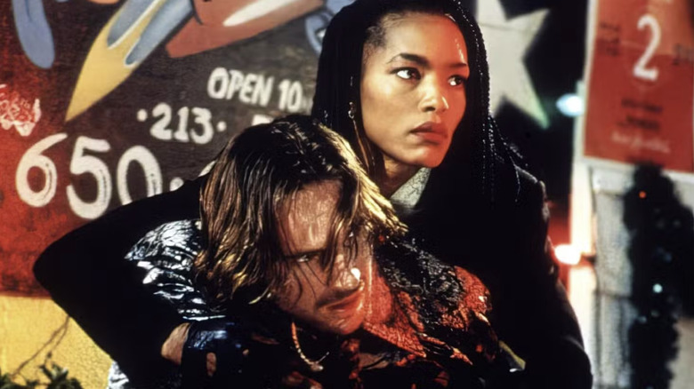 Mace holds up Lenny Nero in "Strange Days" (1995)