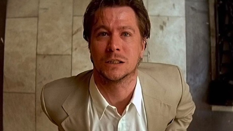 Norman Stansfield looking up with a grimace after taking drugs in "Léon: The Professional"