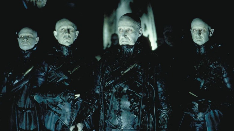 The Strangers gathered wearing all black in "Dark City"