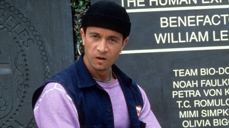 Pauly Shore flexing in front of Bio-Dome (1996) sign